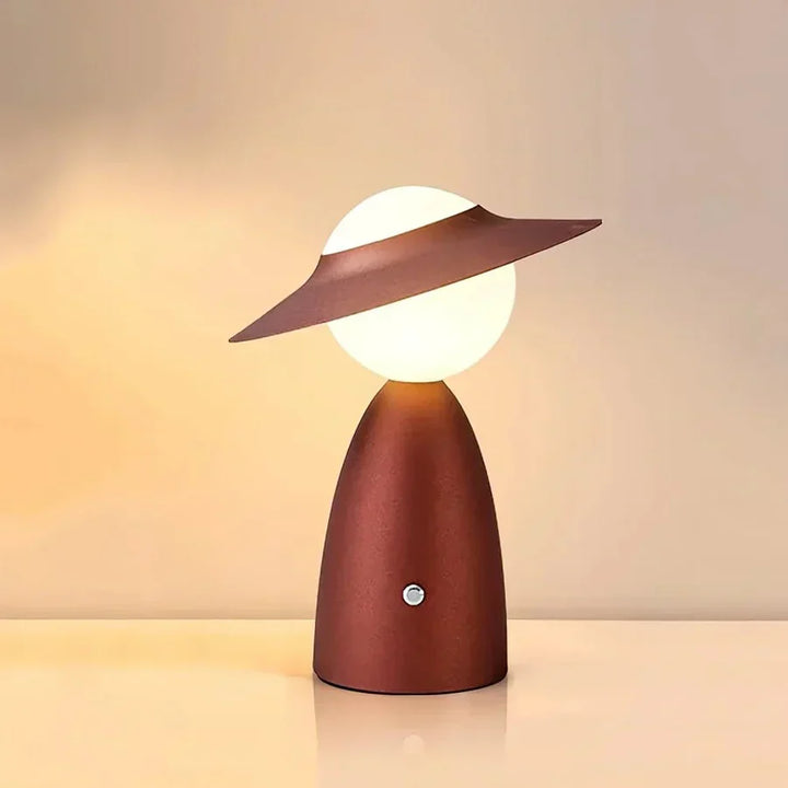 Modern wireless LED table lamp with integrated smartphone charging station, perfect for desks or bedside tables.