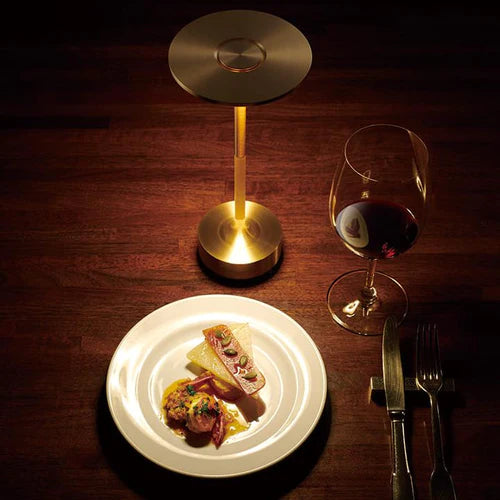 Gold wireless smart table lamp. Modern dimmable LED light for elegant desk, bedside, or ambient home decor.