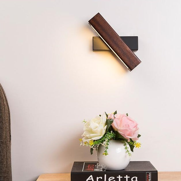 Contemporary natural wood LED wall light, energy-efficient, perfect adjustable home lighting for bedroom.