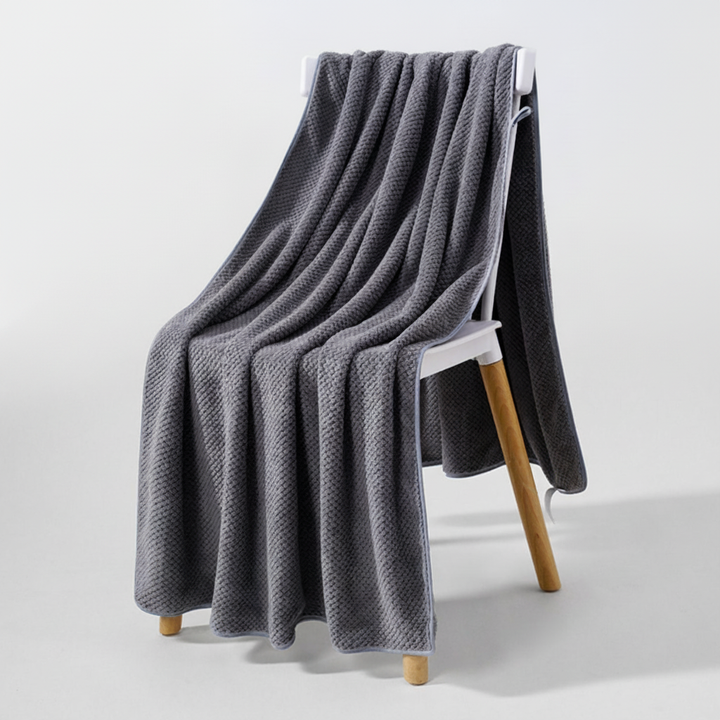 Lightweight and quick-drying coral fleece towel, excellent for travel or as a beach towel.