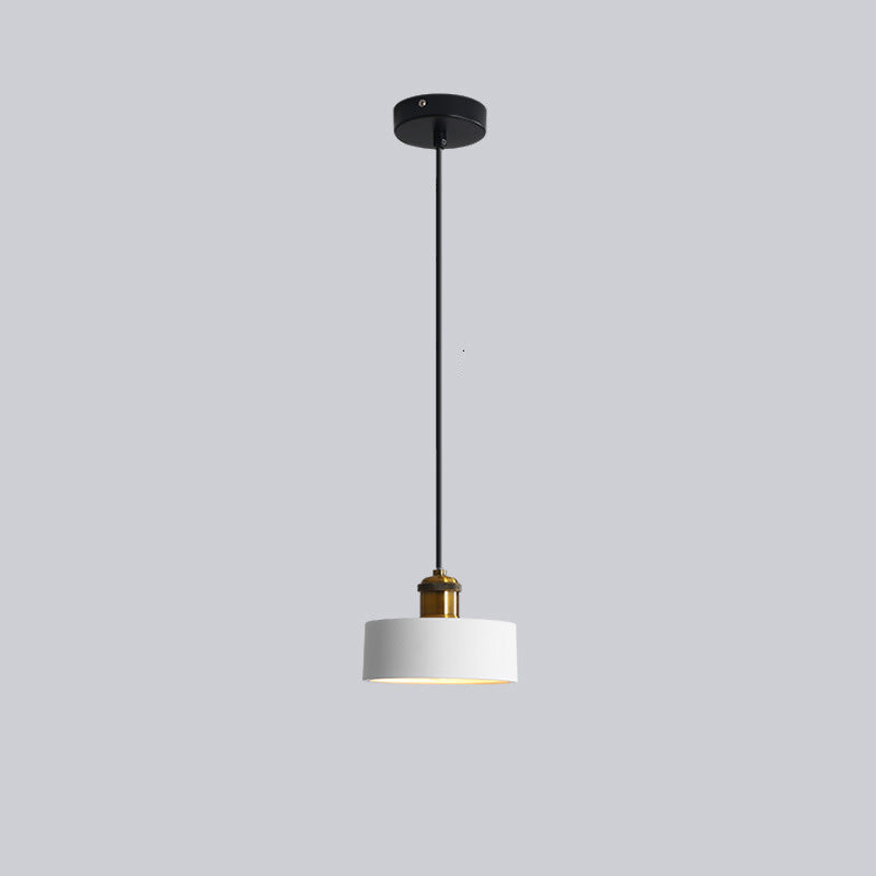 Elegant Morandi LED pendant light, a focal point in a modern dining room.