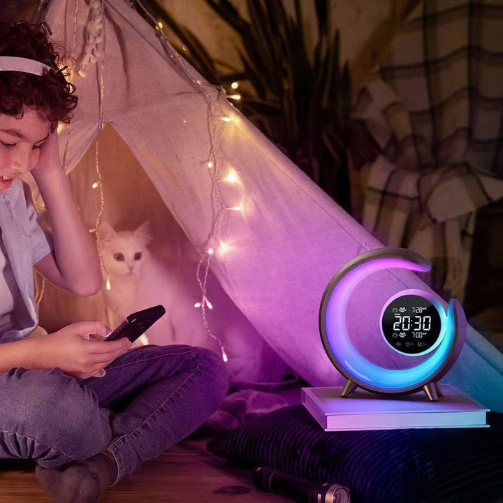 Bedside RGB night light & alarm clock offering white noise & USB charging. A smart sleep aid and mood lamp.