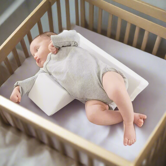 Newborn adjustable anti-roll baby side sleep pillow, memory foam for infant support & flat head prevention.
