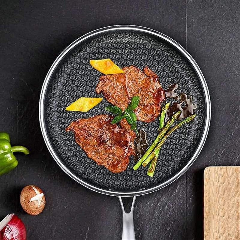 Durable stainless steel frying pan by Novyra featuring advanced non-stick pixel surface for easy food release