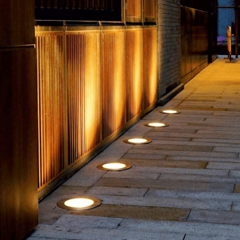 Energy-efficient solar ground lights, waterproof LED outdoor lighting, durable stainless steel for gardens.