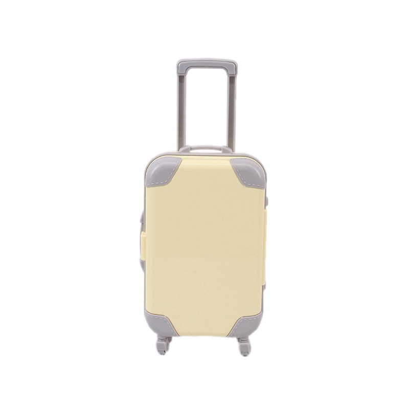 Doll travel suitcase beside an 18-inch doll; perfect kids' toy for adventures, pretend play accessory.