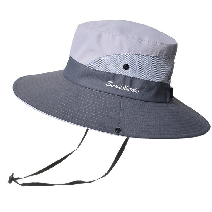 Foldable women's pink beach hat, wide brim design for maximum UV protection.