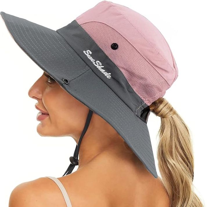 Travel-friendly women's pink wide brim UV protection hat, easily packable.