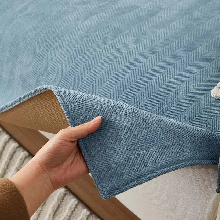 Chenille herringbone furniture protector. Pet-friendly, non-slip sofa cover for modern home decor.