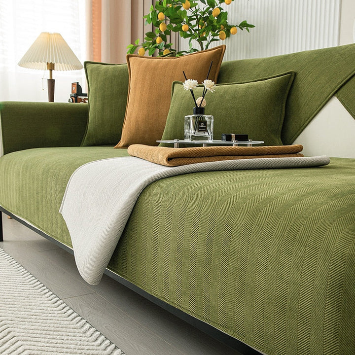 Close-up of plush chenille herringbone pattern on a sofa cover, showing texture & quality.