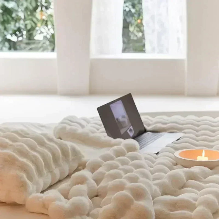 Warm faux fur throw blanket, a cozy and luxurious addition to living room or bedroom decor