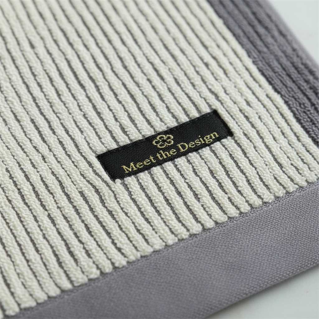 Close-up of a textured bio-cotton spa towel, highlighting its softness and absorbency, perfect for home.