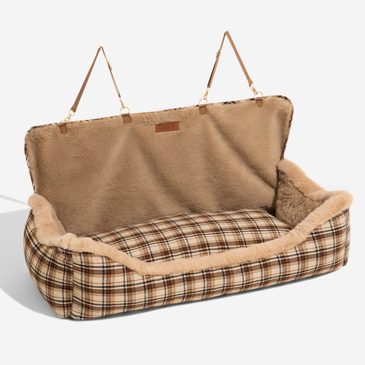 Modern plush pet car seat, combining a cozy dog bed with essential travel safety.