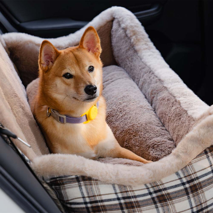 Soft plush pet car bed, the RideSafe CozySeat, for secure and comfortable dog travel.