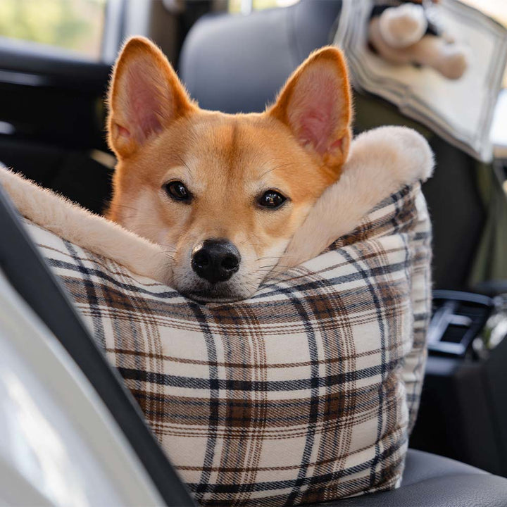 Safe & cozy plush pet car seat for dogs, perfect for secure and comfortable road trips.