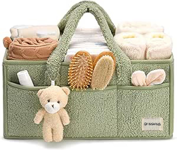 Aerial view of an open pink sherpa baby caddy, empty compartments waiting for baby items