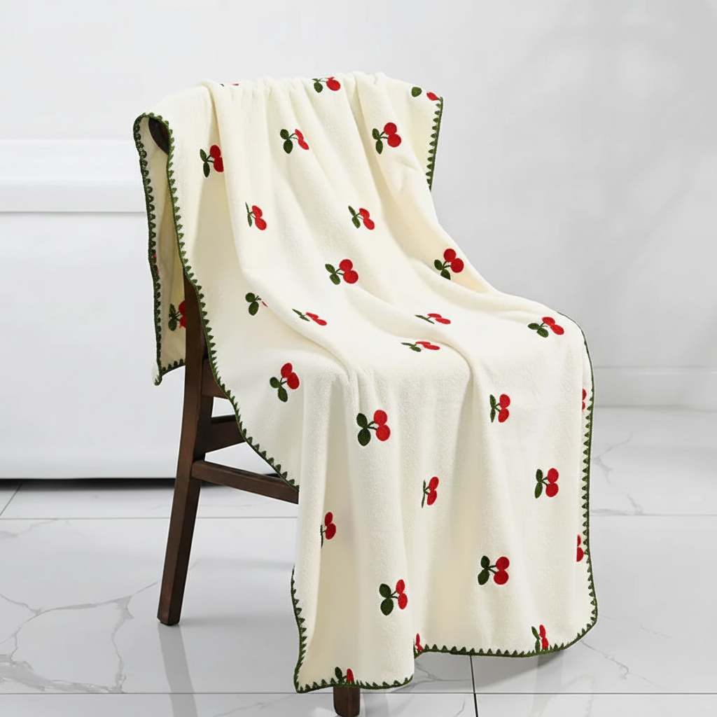 High-quality absorbent bath towels with colorful fruit embroidery, adding luxury to any bathroom.