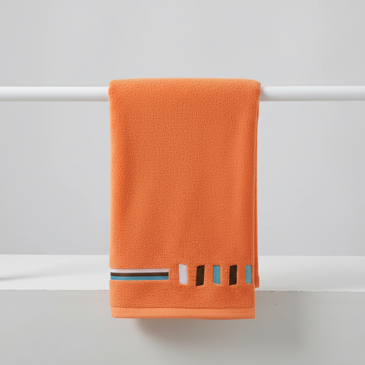 Detail shot of the fluffy loops on the luxury cotton towel, emphasizing its superior softness.
