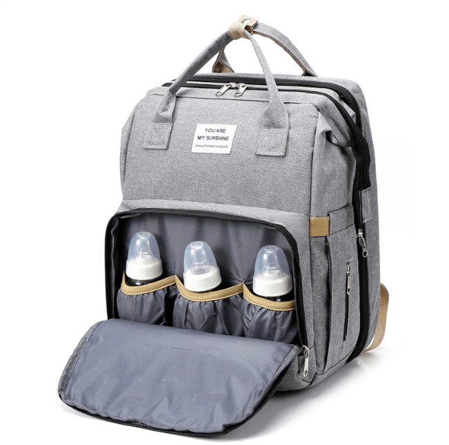 Baby gear: Portable nappy bag backpack featuring a pull-out bassinet and changing area.