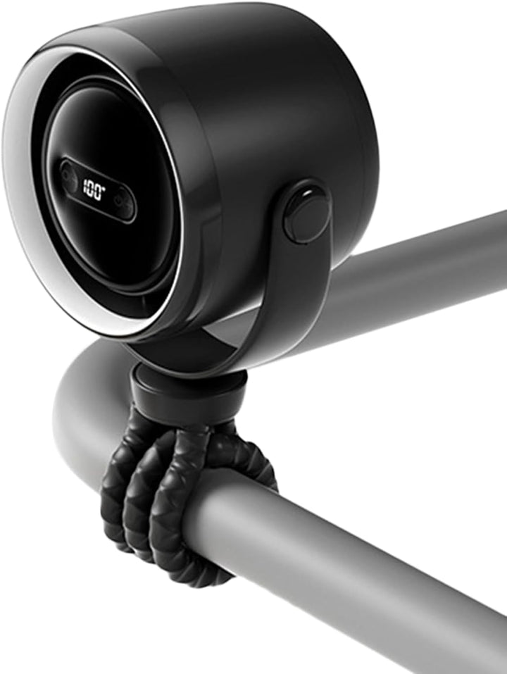 Detail of the fan's strong clip, securing it to a table edge, demonstrating versatility.