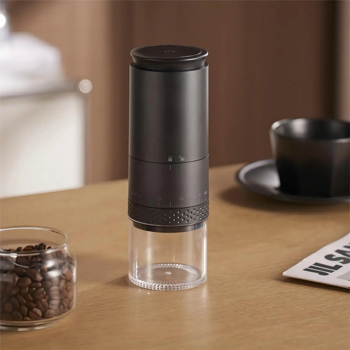 Electric coffee bean grinder with adjustable settings for espresso, pour-over, or French press coffee.
