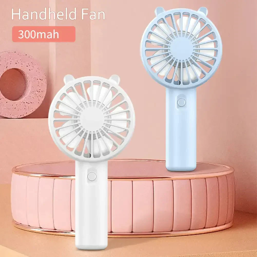 Rechargeable mini fan in a sleek design, providing portable relief from heat, a travel accessory.