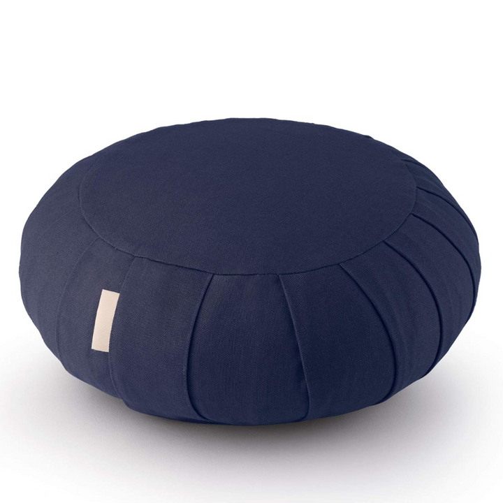 Close-up of organic cotton meditation cushion texture, highlighting quality fabric and buckwheat filling.