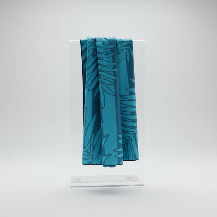 Compact microfiber beach towel set featuring a reversible tropical design, perfect for outdoor use