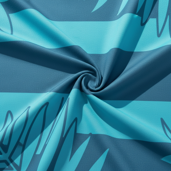 Soft microfiber beach towel with a tropical print and solid reverse, perfect for quick drying after swimming