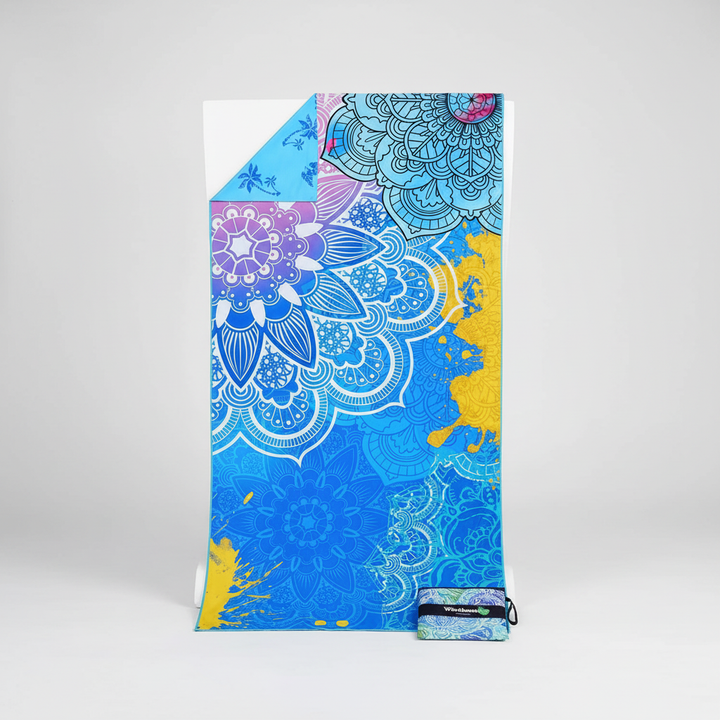 Lightweight and absorbent TropicalTouch beach towel, excellent for beach days, travel, or gym workouts