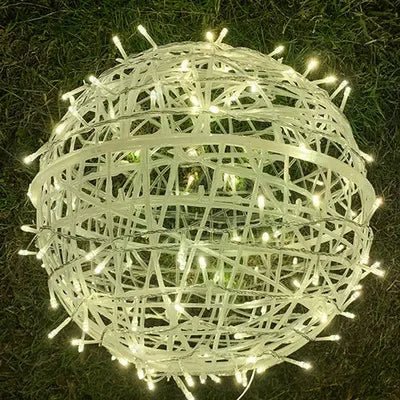 Handwoven rattan LED light ball, offering beautiful diffused light for home decor.