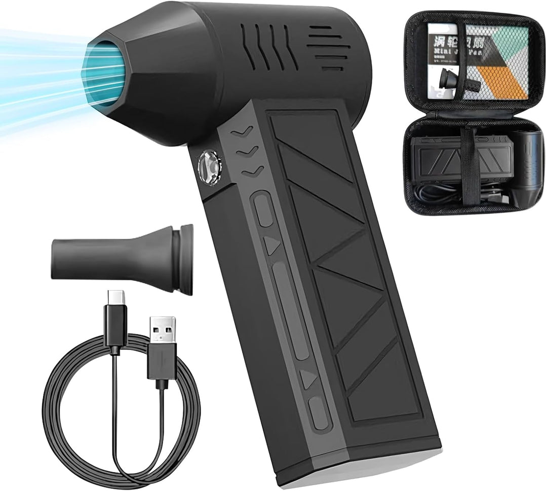 Handheld electric duster blowing air onto a dusty keyboard, demonstrating effectiveness