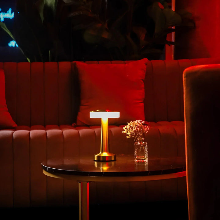 Sleek retro dimmable LED desk lamp, wireless and portable for versatile use.