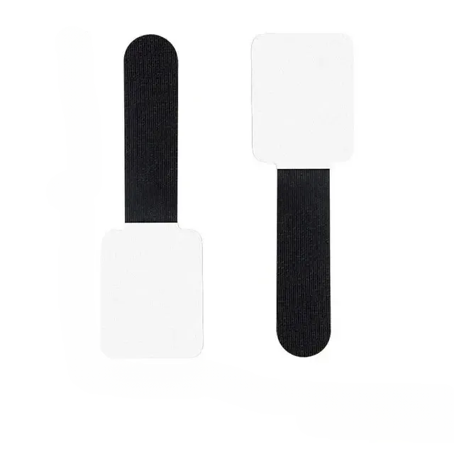 Close-up of the adhesive strip on a reusable cable tie, ready to attach to a surface