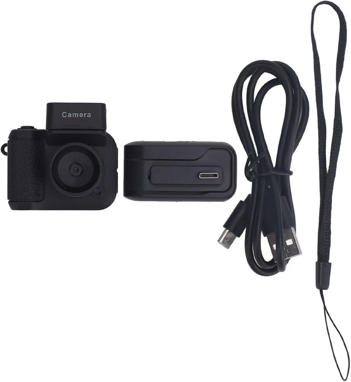 Rivoma portable 1080P keychain camera, retro design, on a wooden table with accessories