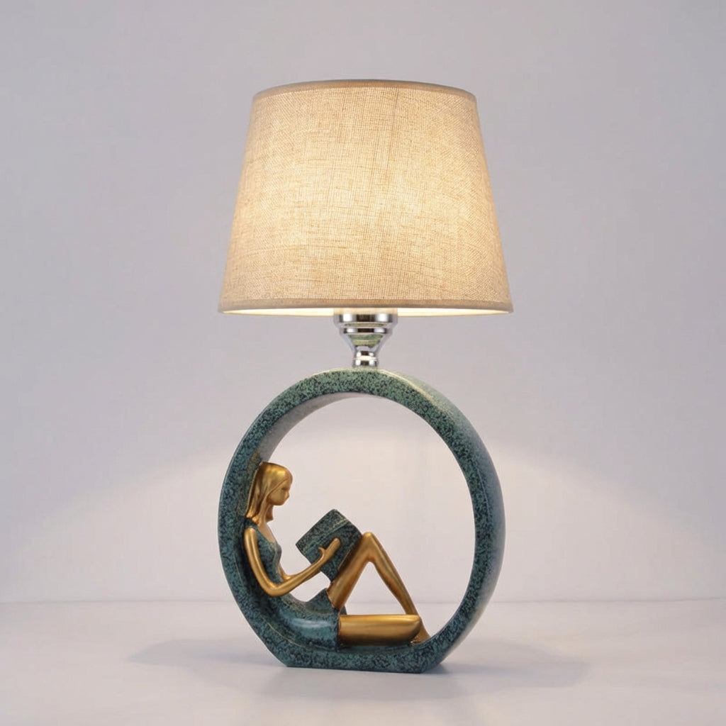 Elegant Readelle sculptural reading girl table lamp with fabric shade, adds unique charm to home decor