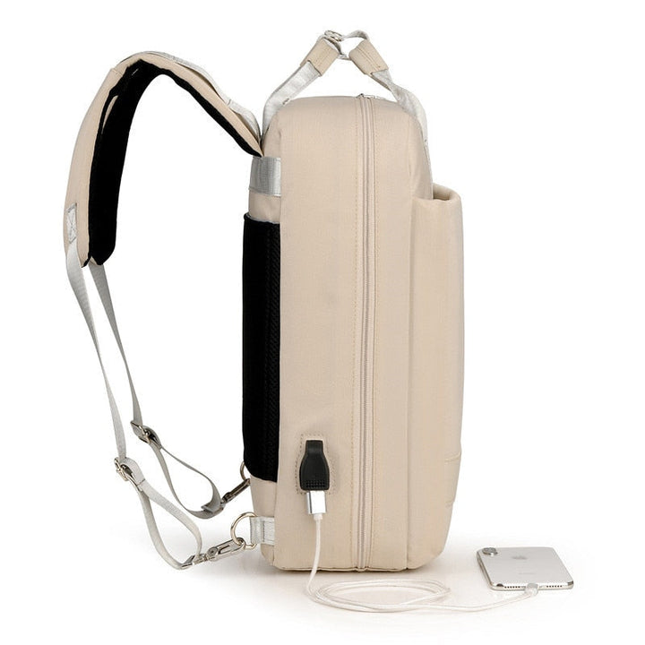 Side view of grey anti-theft backpack highlighting slim profile and secure, easy-access compartments.