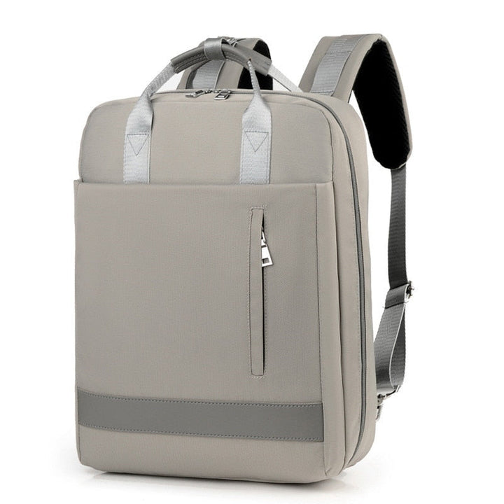 Interior view of anti-theft travel bag, ample space for laptop and essentials, organized pockets.