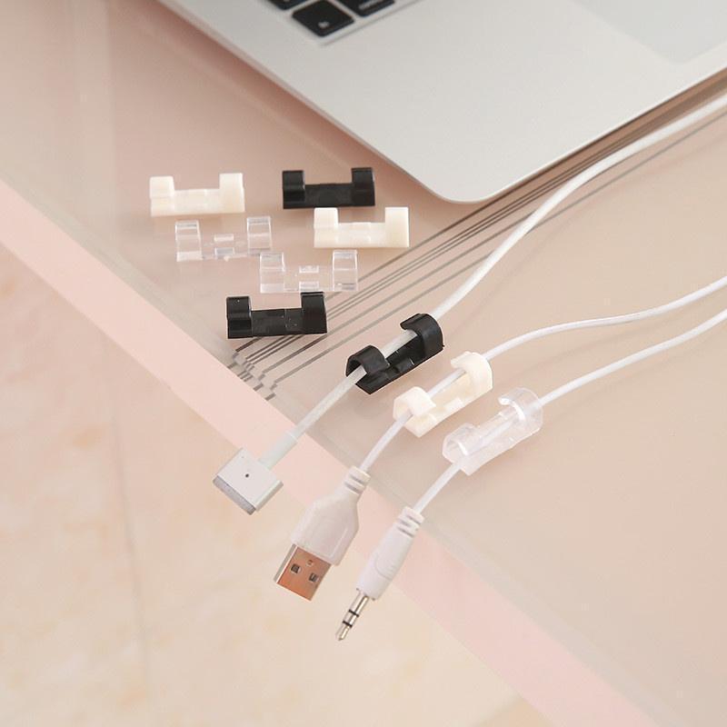 Self-adhesive cable management clips for organizing computer cables under desks & walls.