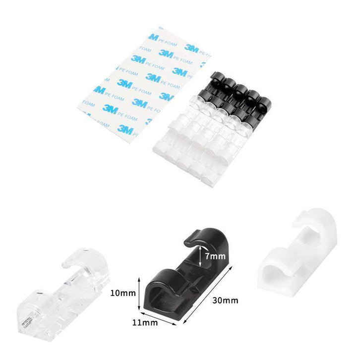 Close-up of black self-adhesive cable management clips, essential desk accessories for wire organization.