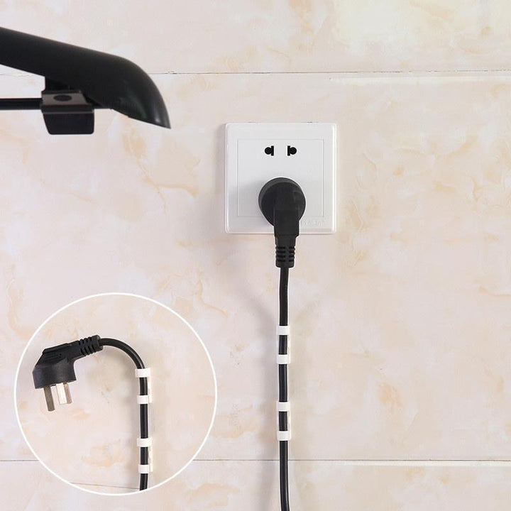Discreet desk cable clips for computer cables, ensuring a neat home office & organized workspace.