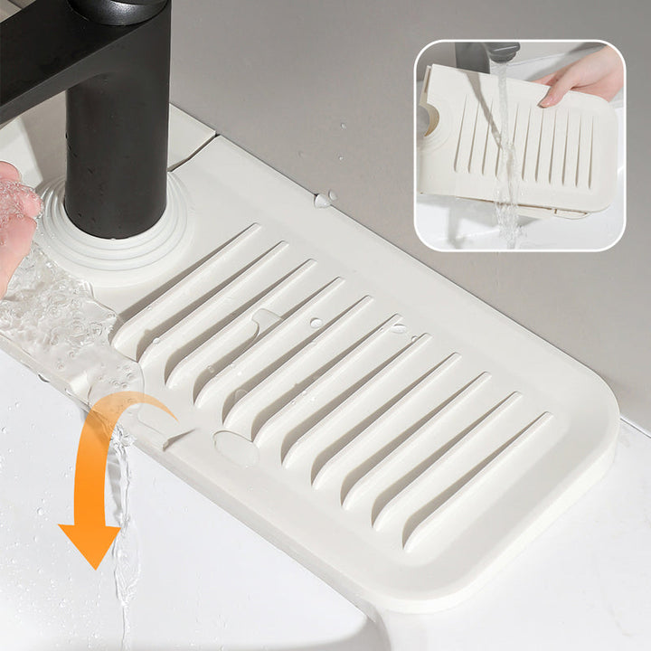 Heat-resistant, anti-slip silicone draining mat keeps kitchen countertops dry & organized.