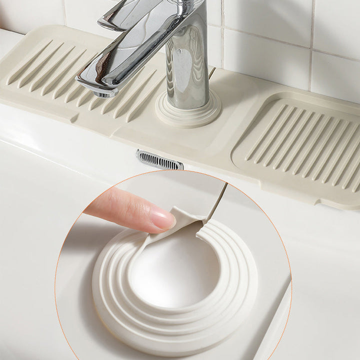 Anti-slip, heat-resistant silicone drying mat for kitchen countertops; easy organization.