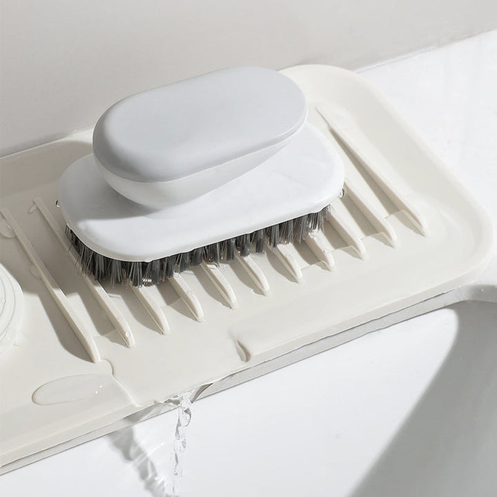 Durable, self-draining silicone mat for efficient kitchen dish drying and counter organization.