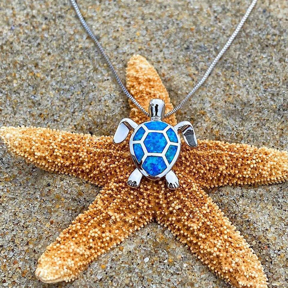 Elegant women's silver sea turtle necklace with iridescent opal. Perfect ocean-inspired animal jewelry gift.