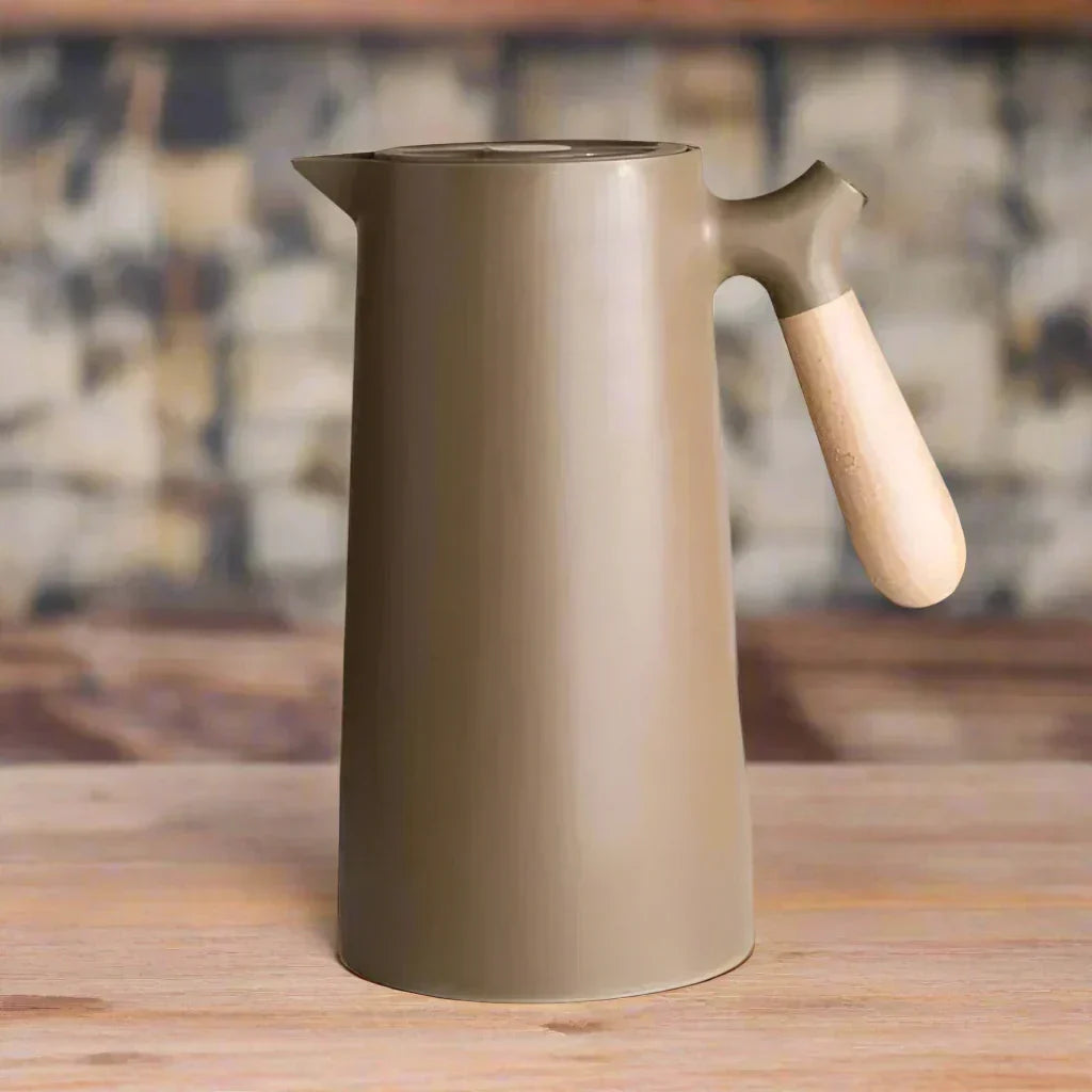 Modern NordicTherm stainless steel thermal flask, a sleek and reusable bottle for hot beverages or cold water.