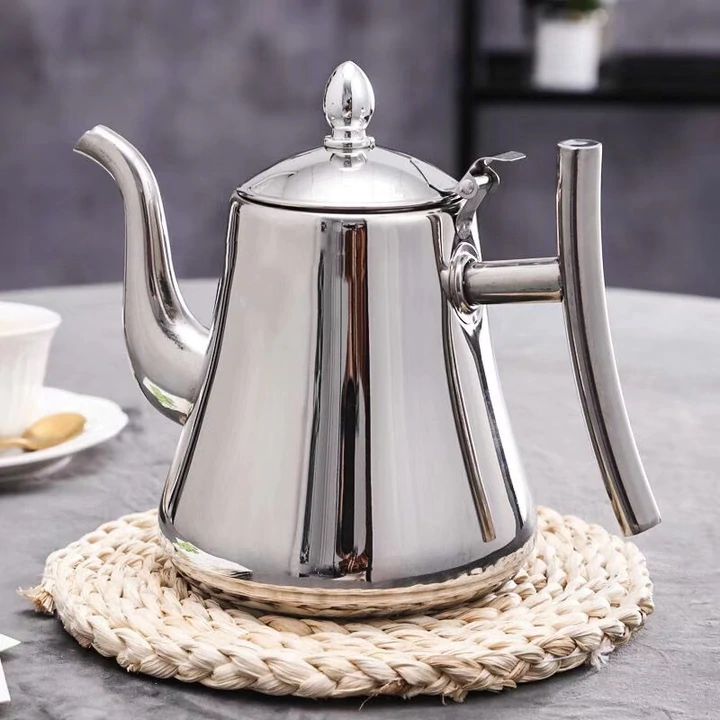 Modern stainless steel induction tea kettle with built-in water filter, perfect for durable stovetop brewing.