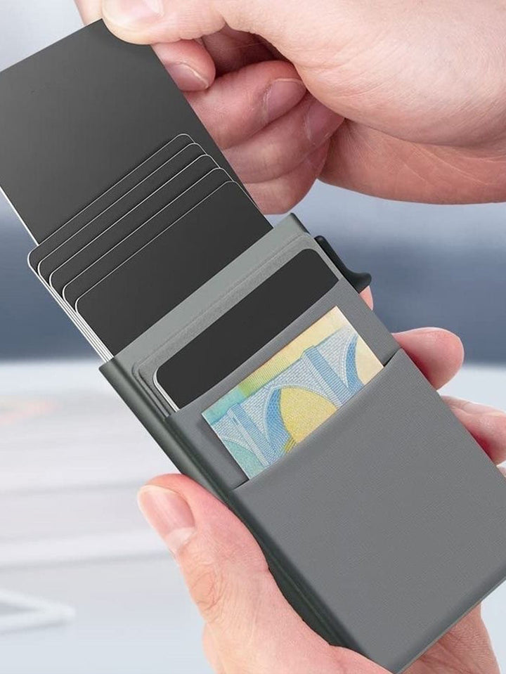 Minimalist men's wallet, silver finish, designed to protect credit cards from RFID theft