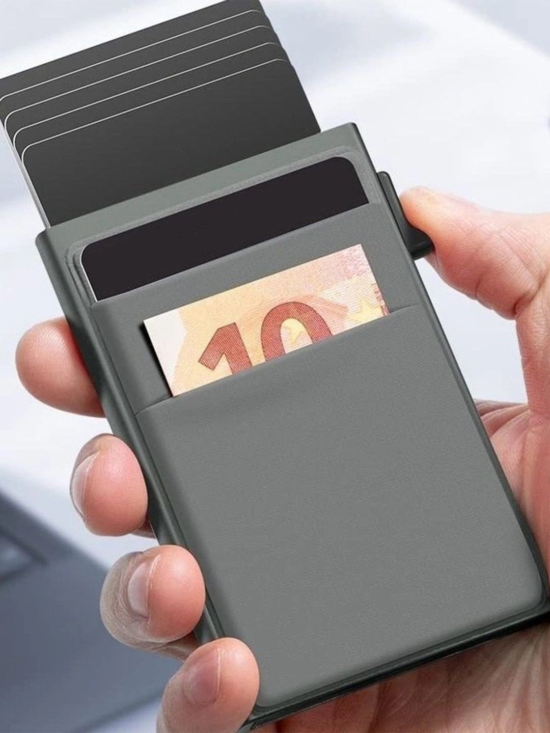 Thin metal wallet for men, showing cards neatly organized inside, RFID secure