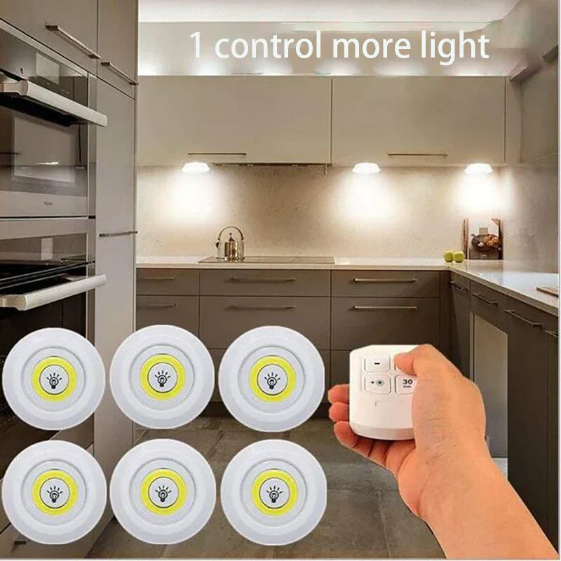 Wireless LED puck lights illuminating an under cabinet area in a modern kitchen, energy-saving
